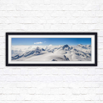 Swiss Alps mountain landscape. Panoramic framed picture print. Vibrant blue and white image. Choice of frame colours.