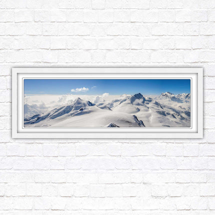 Swiss Alps mountain landscape. Panoramic framed picture print. Vibrant blue and white image. Choice of frame colours.